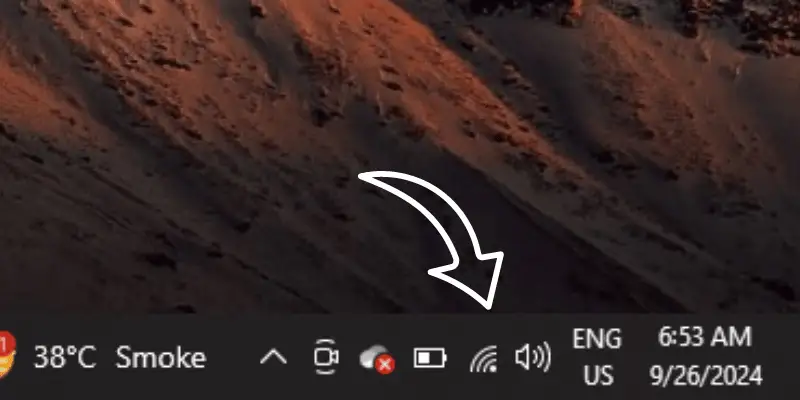 Laptop taskbar with Wi-Fi icon and other system indicators
