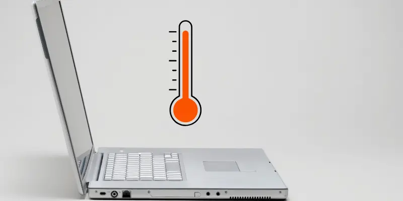 Silver laptop with a red thermometer icon showing heat.