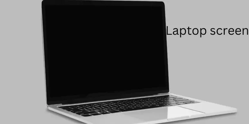 Laptop on gray background with a clean black screen.