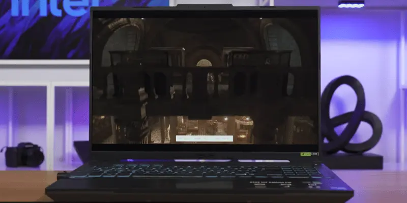 ASUS gaming laptop displaying 3D graphics on screen
