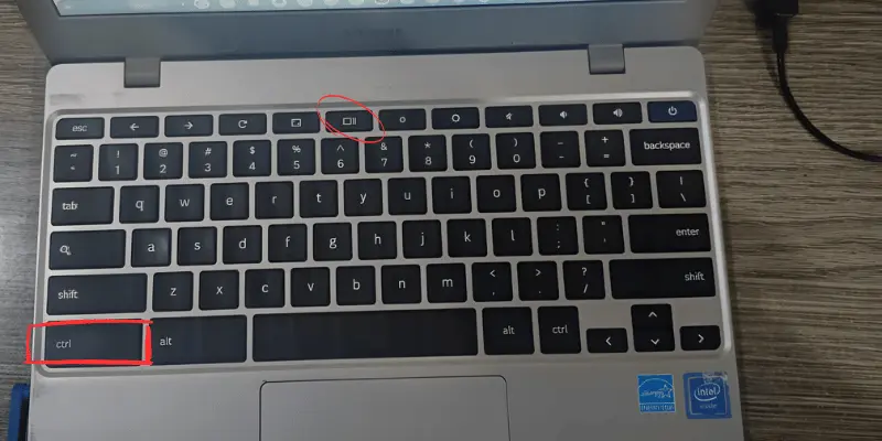 Laptop keyboard with focus on Ctrl and Show Windows buttons
