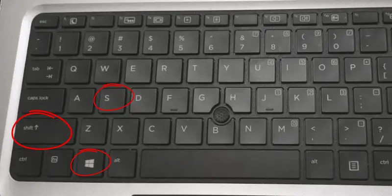 Laptop keyboard highlighting (Shift, Windows, and S) keys