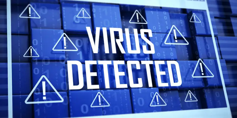 Blue digital screen with alert symbols and the message "Virus Detected" indicating malware presence on a system. Blue digital screen with alert symbols and the message "Virus Detected" indicating malware presence on a system.