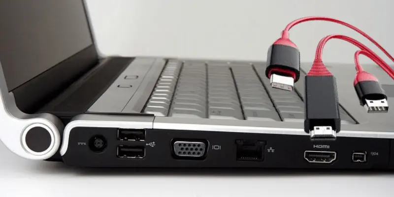 Laptop showcasing HDMI, USB, and VGA ports with red connectors