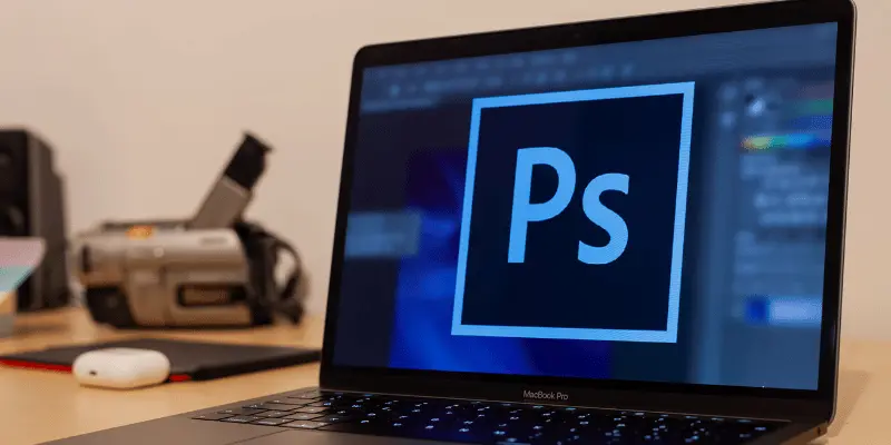 Laptop with Photoshop logo displayed on screen