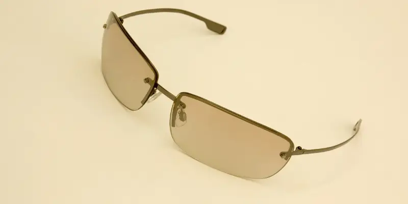 Stylish polarized sunglasses with a sleek metal frame on a beige background